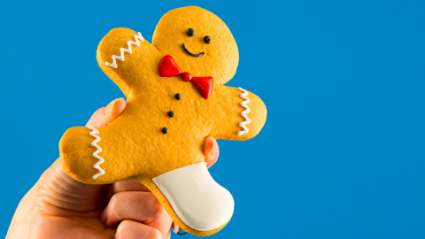 Photo of gingerbread cookie with a leg in cast