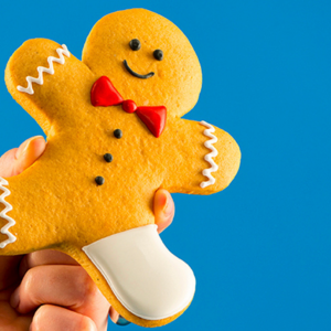 Photo of gingerbread cookie with a leg in cast