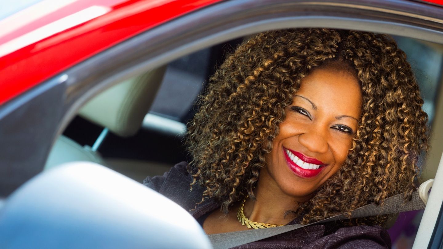 Woman in driver's seat of car