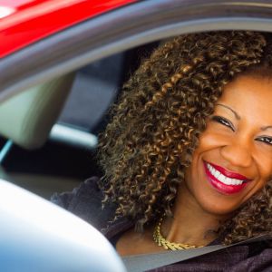 Woman in driver's seat of car