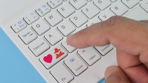 Keyboard with heart and scammer icon added